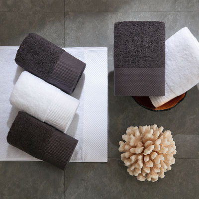 Προσαρμοσμένο λογότυπο Luxury 5 Star Hotel White 100% βαμβάκι Dobby Face Hand Bath Towels Set